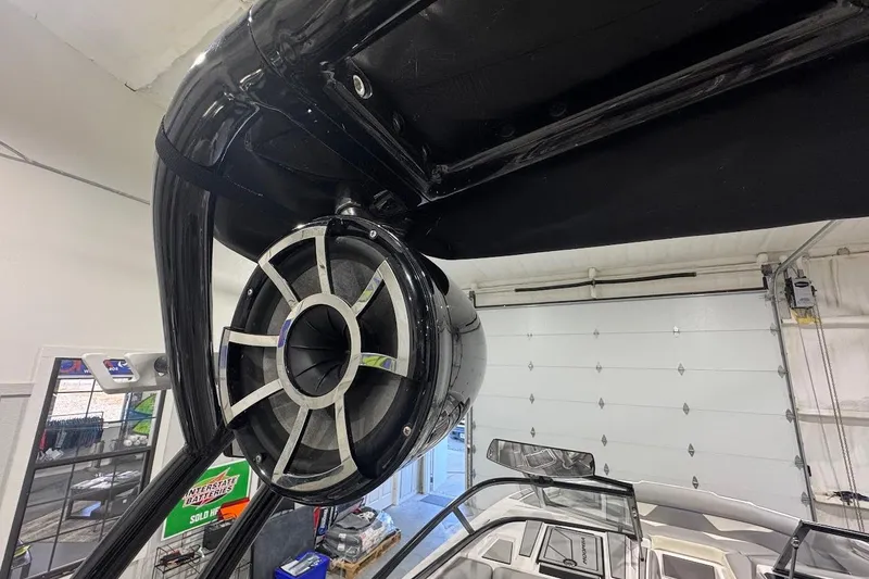 Slide: The Image of 2020 Moomba Makai boat with mounted speaker in a garage setting. - 18