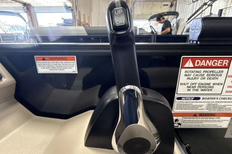 Slide: The Image of Throttle control of 2026 Bennington 22 SSRSE boat with safety warnings visible. - 22