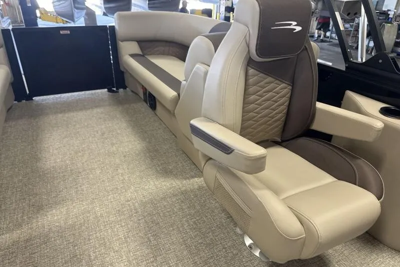 Slide: The Image of Luxurious interior seating of 2026 Bennington 22 SSRSE pontoon boat with beige upholstery. - 24