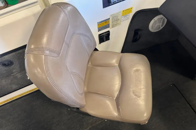 Slide: The Image of Beige leather seat in a 1998 Skeeter WX1850 boat interior. - 10