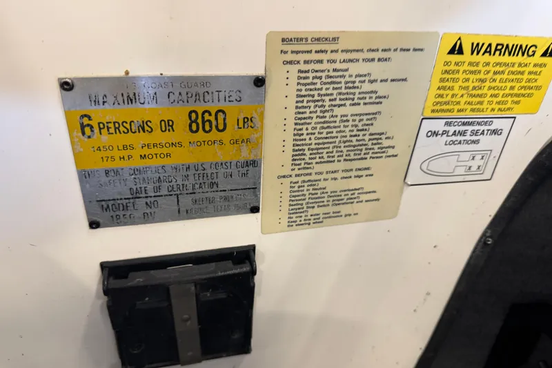 Slide: The Image of 1998 Skeeter WX1850 capacity and safety labels, including maximum load and boater's checklist. - 11