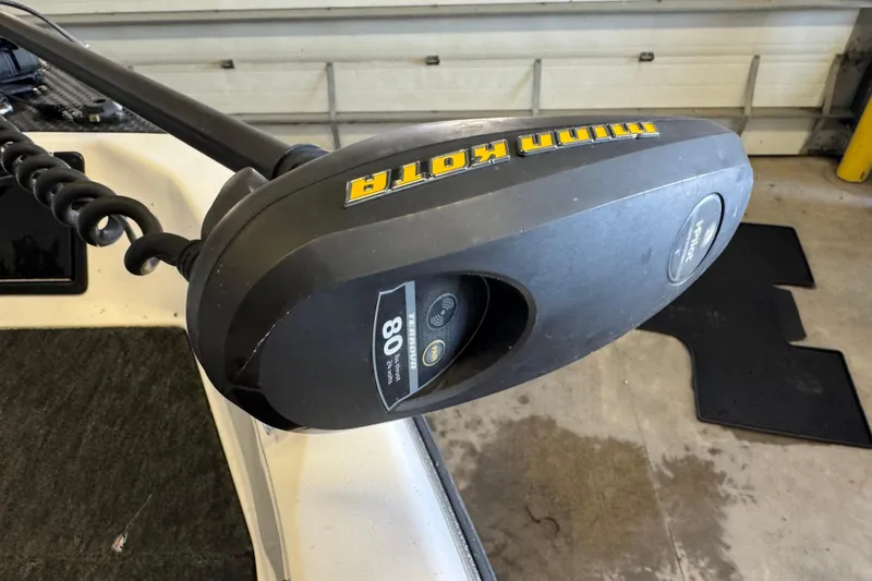 Slide: The Image of Minn Kota trolling motor on 1998 Skeeter WX1850 boat in a garage setting. - 15