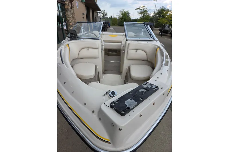 Slide: The Image of 2003 Glastron GX185SF boat interior with beige seating and windshield. - 4