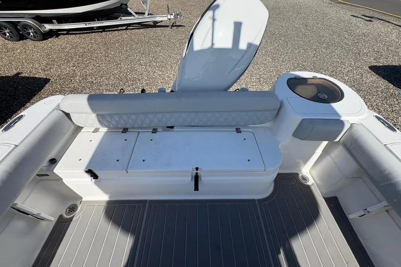 Slide: The Image of 2012 Sea Fox 226 Center Console boat interior with seating and storage compartments. - 10