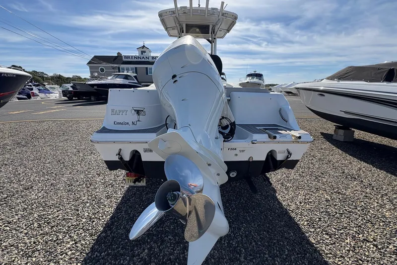 Slide: The Image of 2012 Sea Fox 226 Center Console boat with outboard motor, parked at marina. - 11