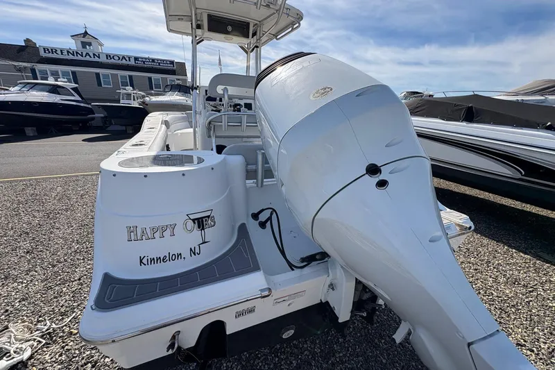 Slide: The Image of 2012 Sea Fox 226 Center Console boat with outboard motor, labeled "Happy Ours," in Kinnelon, NJ. - 12