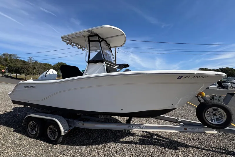 Slide: The Image of 2012 Sea Fox 226 Center Console boat on trailer, featuring Suzuki outboard motor. - 2