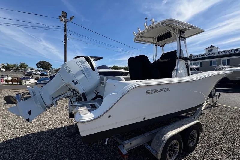 Slide: The Image of 2012 Sea Fox 226 Center Console boat on trailer, featuring Suzuki outboard motor. - 3