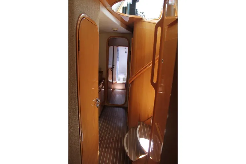Slide: The Image of Interior hallway of 2006 Alliaura Marine Privilege 435 EZC yacht, featuring wooden finishes. - 20