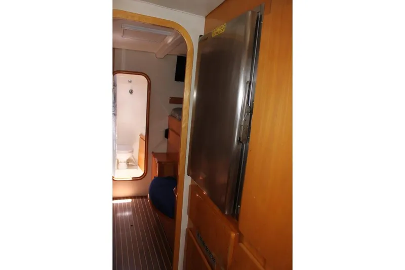 Slide: The Image of Interior of 2006 Alliaura Marine Privilege 435 EZC yacht, featuring a compact bathroom. - 25