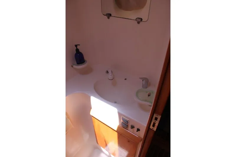 Slide: The Image of Bathroom sink area in 2006 Alliaura Marine Privilege 435 EZC yacht. - 26