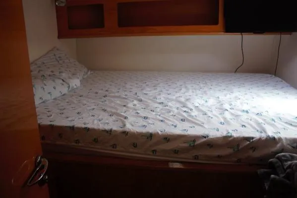 Slide: The Image of Cozy bedroom in 2006 Alliaura Marine Privilege 435 EZC yacht with patterned bedding. - 27