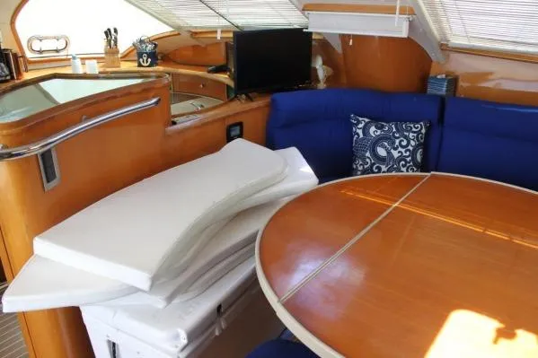 Slide: The Image of Interior of 2006 Alliaura Marine Privilege 435 EZC yacht with dining area and cushions. - 3