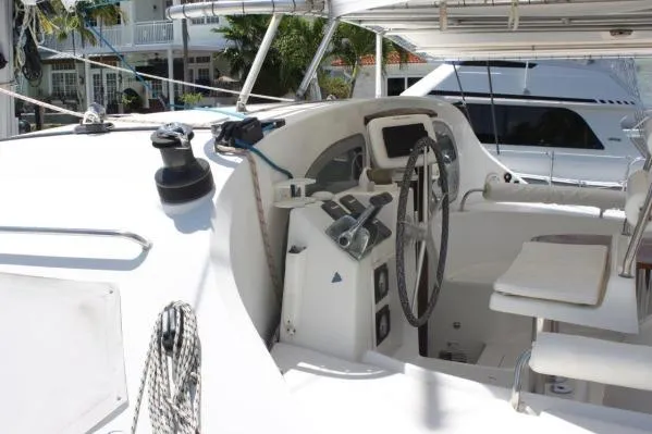 Slide: The Image of 2006 Alliaura Marine Privilege 435 EZC yacht cockpit with steering wheel and navigation controls. - 33