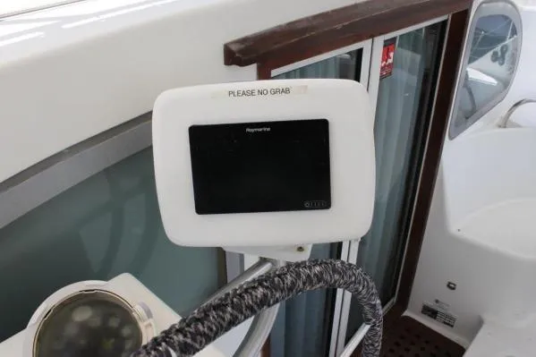 Slide: The Image of 2006 Alliaura Marine Privilege 435 EZC yacht helm with navigation display. - 35