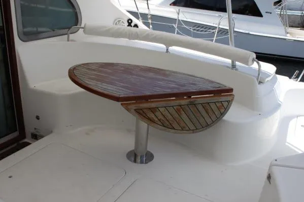 Slide: The Image of 2006 Alliaura Marine Privilege 435 EZC yacht with wooden deck table. - 37