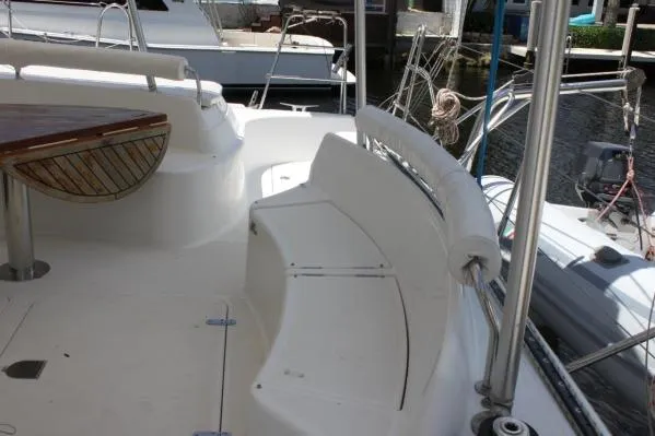 Slide: The Image of 2006 Alliaura Marine Privilege 435 EZC yacht deck with seating and table. - 38