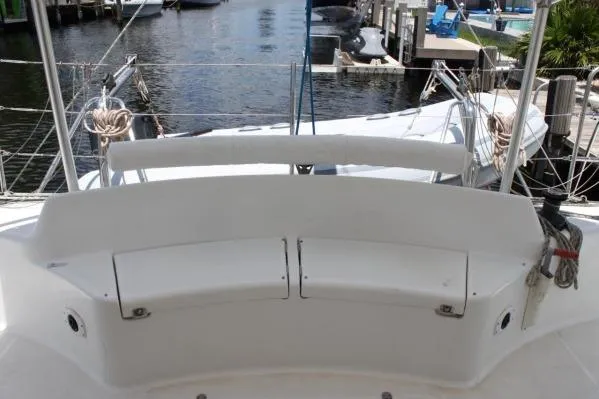 Slide: The Image of 2006 Alliaura Marine Privilege 435 EZC yacht cockpit with white seating and marina view. - 39