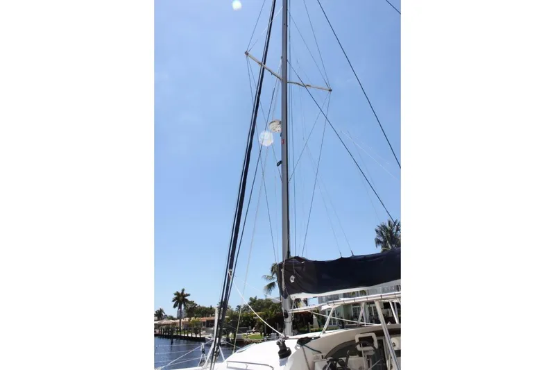 Slide: The Image of Sailboat mast of 2006 Alliaura Marine Privilege 435 EZC against clear blue sky. - 45