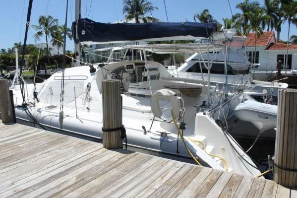 Slide: The Image of 2006 Alliaura Marine Privilege 435 EZC catamaran docked at a marina. - 47