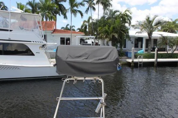 Slide: The Image of Covered equipment on Alliaura Marine Privilege 435 EZC, docked near waterfront homes, 2006 model. - 57