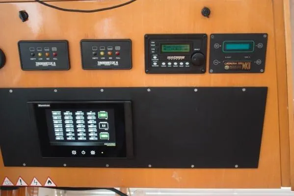 Slide: The Image of Control panel of 2006 Alliaura Marine Privilege 435 EZC yacht with various electronic displays. - 62