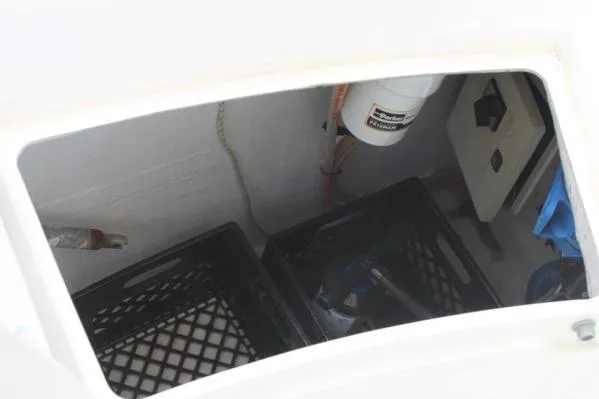 Slide: The Image of Storage compartment of 2006 Alliaura Marine Privilege 435 EZC with crates and equipment. - 77