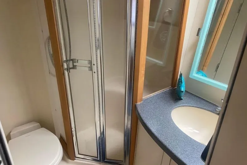 Slide: The Image of Bathroom interior of 2000 Luhrs Tournament 360 Convertible yacht with shower and sink. - 19