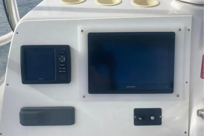 Slide: The Image of Control panel of 2000 Luhrs Tournament 360 Convertible with Garmin displays. - 26