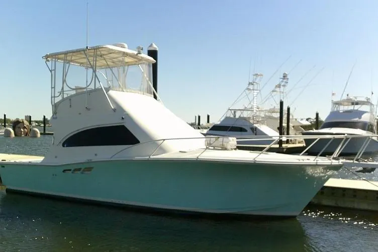 Slide: The Image of 2000 Luhrs Tournament 360 Convertible yacht docked at marina. - 9