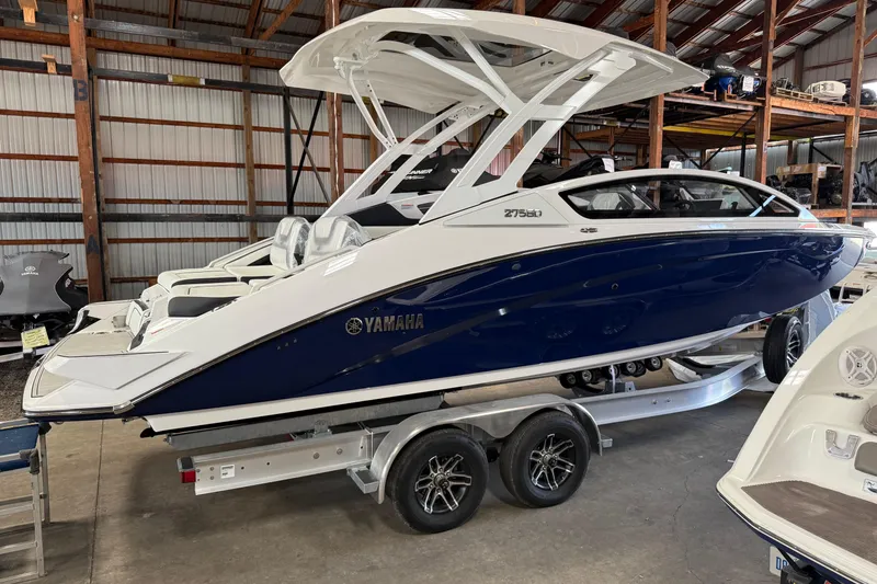 The Image of 2026 Yamaha Boats 275SD in a warehouse, showcasing sleek design and modern features. - 0
