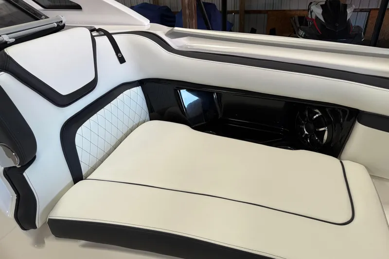 Slide: The Image of Luxurious seating in 2026 Yamaha Boats 275SD, featuring elegant white and black upholstery. - 13