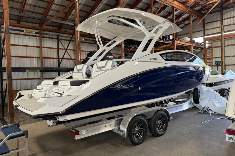Slide: The Image of 2026 Yamaha Boats 275SD in a warehouse, sleek design on a trailer. - 3