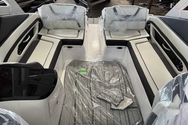 Slide: The Image of 2026 Yamaha Boats 275SD interior with sleek seating and protective coverings. - 7