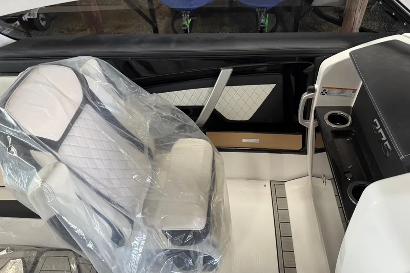 Slide: The Image of Interior of 2026 Yamaha Boats 275SD, featuring a covered seat and sleek design elements. - 8