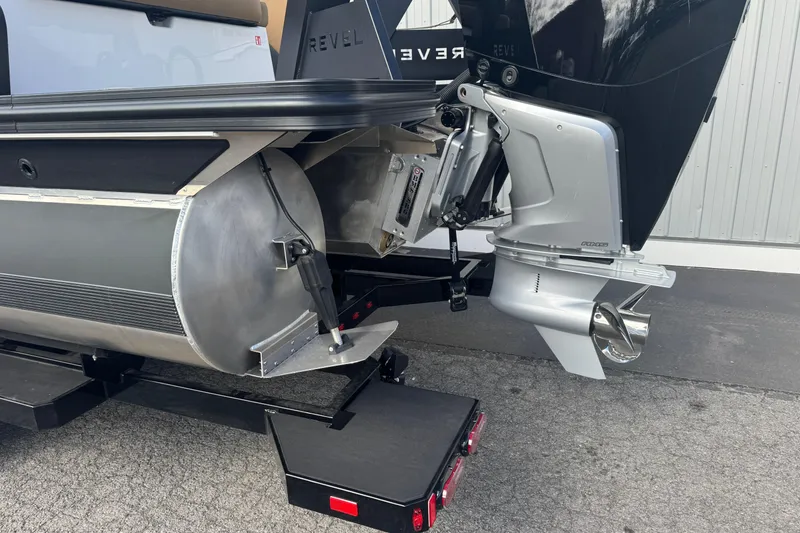Slide: The Image of 2026 Revel RS25 boat with advanced outboard motor and sleek design. - 14