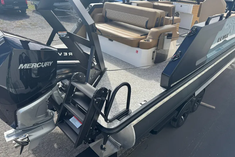 Slide: The Image of 2026 Revel RS25 boat with Mercury engine, featuring comfortable seating and modern design. - 16