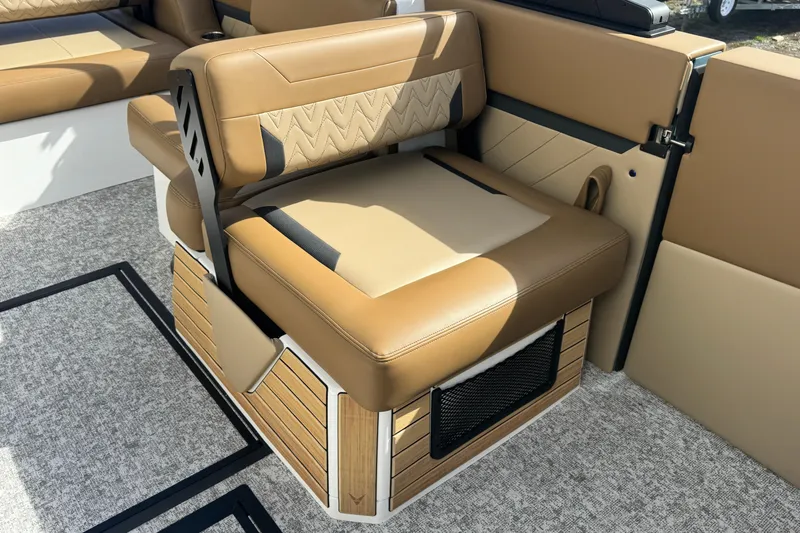 Slide: The Image of Luxurious tan seating in 2026 Revel RS25 boat, featuring stylish design and comfortable upholstery. - 20