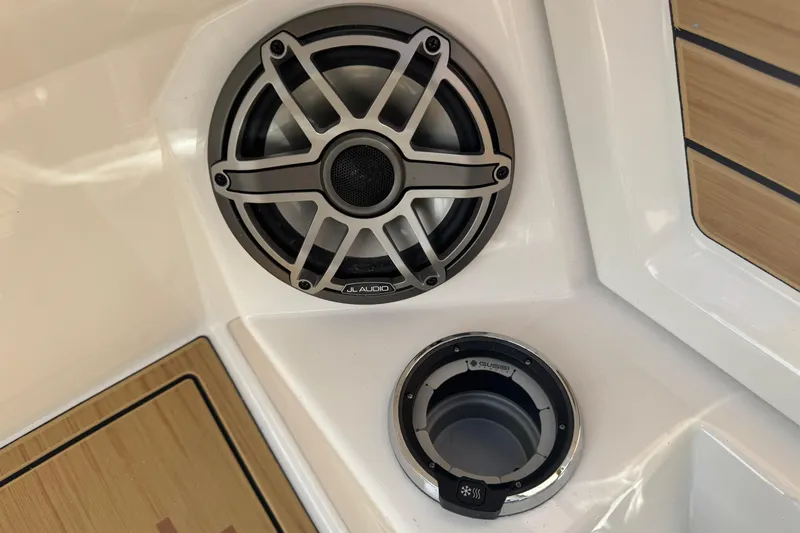 Slide: The Image of Revel RS25 2026 boat interior featuring JL Audio speaker and Gussi cup holder. - 37