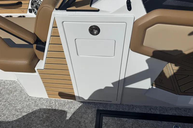 Slide: The Image of Interior of 2026 Revel RS25 boat with tan seating and wood accents. - 39