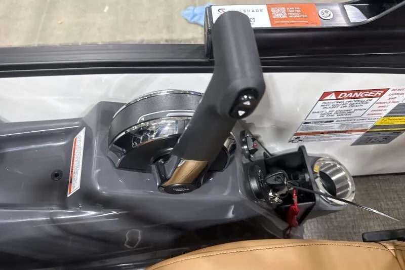 Slide: The Image of Throttle control of 2026 Bennington 22 MSBSF boat with warning labels visible. - 18