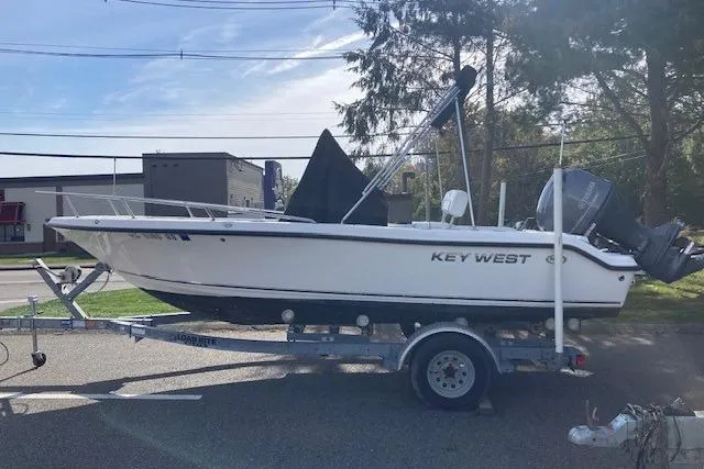 Slide: The Image of 2013 Key West 189 FS boat on trailer, parked outdoors. - 12