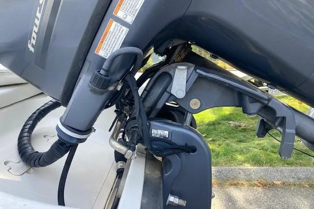 Slide: The Image of 2013 Key West 189 FS boat engine close-up, showcasing mechanical components and wiring. - 14