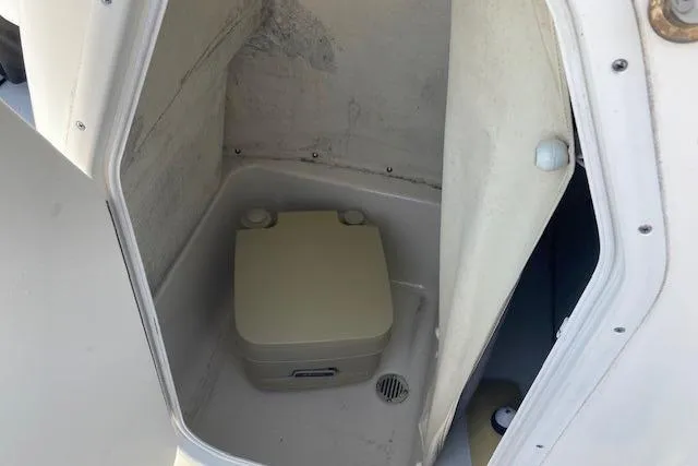 Slide: The Image of Portable toilet inside 2013 Key West 189 FS boat compartment. - 15