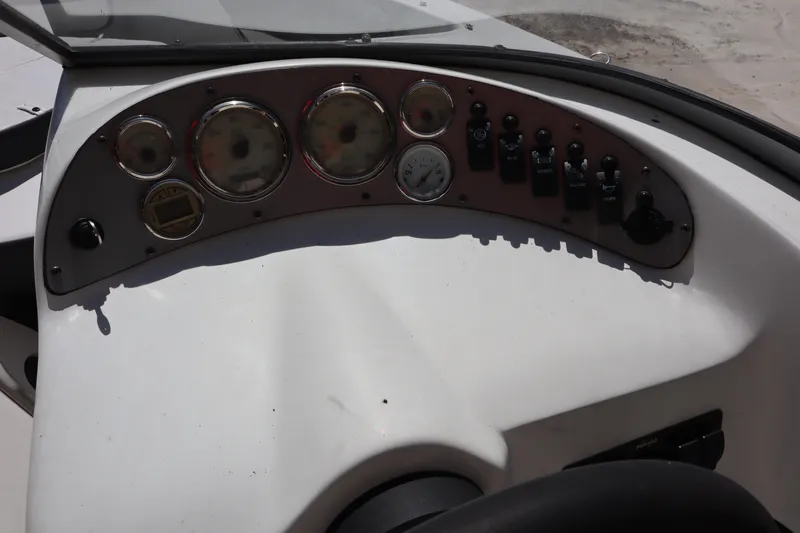 Slide: The Image of Dashboard of 2014 Caravelle 19 EBo Bowrider boat with gauges and controls. - 14