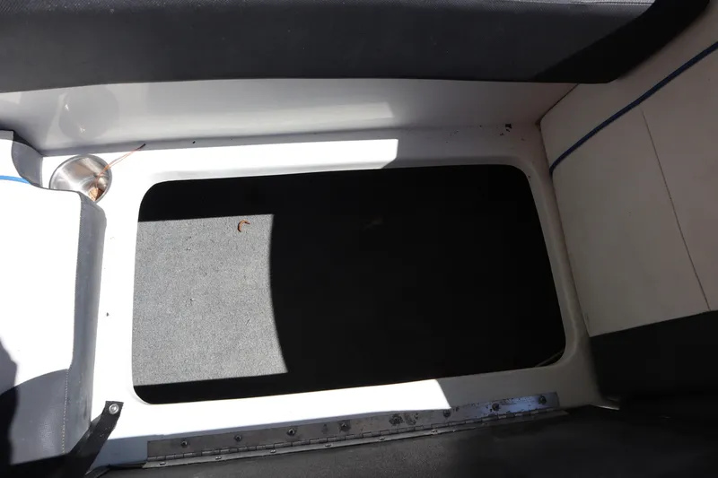 Slide: The Image of Interior view of 2014 Caravelle 19 EBo Bowrider boat storage compartment. - 22