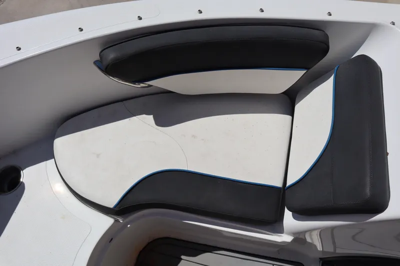 Slide: The Image of 2014 Caravelle 19 EBo Bowrider interior seating with black and white upholstery. - 6