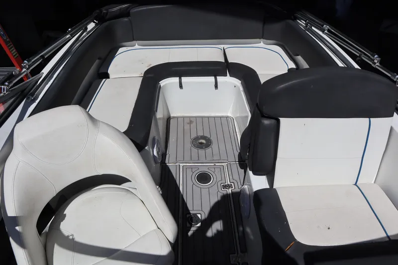 Slide: The Image of 2014 Caravelle 19 EBo Bowrider interior with white and black seating. - 8