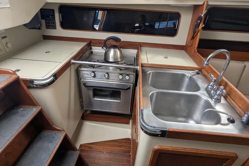 Slide: The Image of Interior of a 1980 C&C 36 sailboat with navigation equipment and control panel. - 11