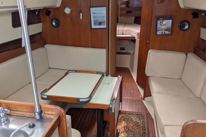 Slide: The Image of Cockpit of a 1980 C&C 36 sailboat with ropes and wooden hatch. - 3